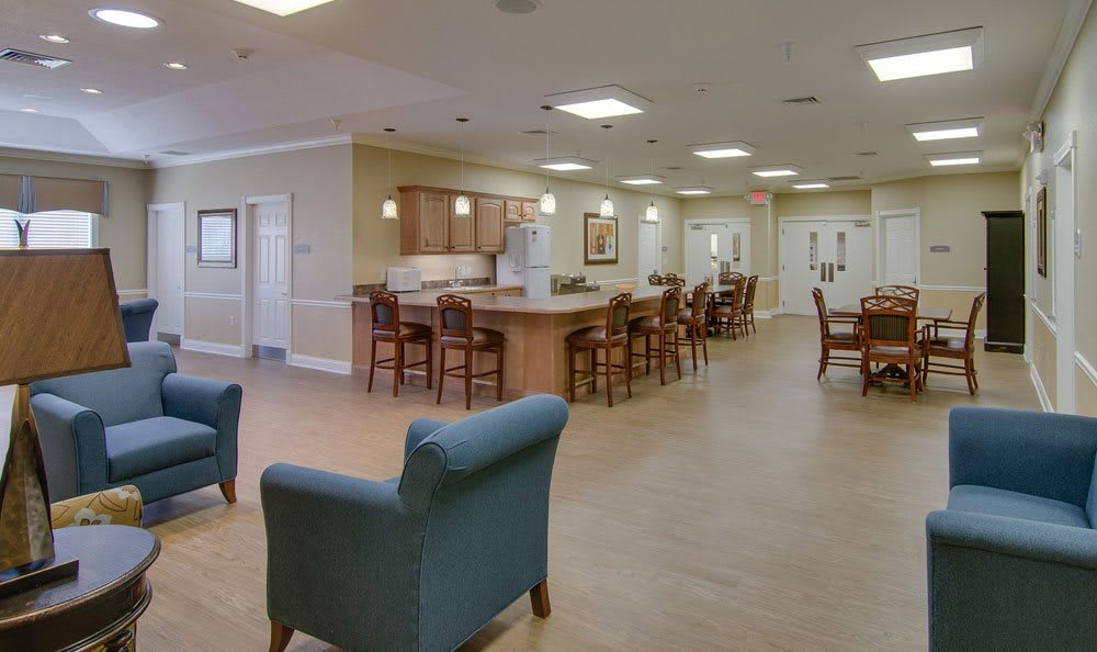 A spacious modern kitchen and dining area with wooden furniture.