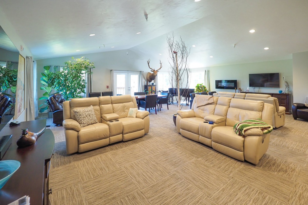 A spacious living room with comfortable sofas and tasteful decor.
