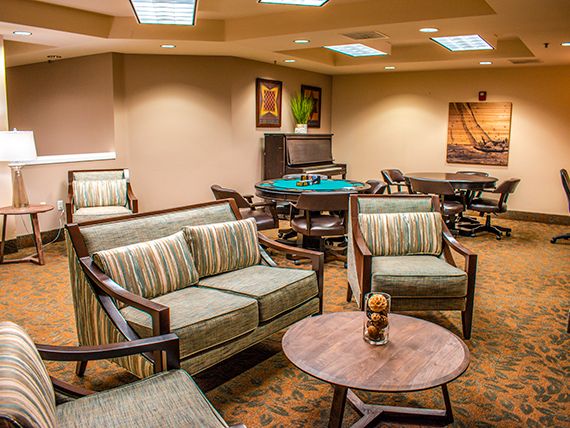 A cozy lounge area with comfortable seating and a warm atmosphere.