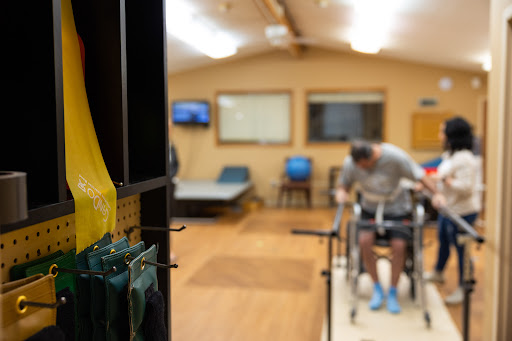 A person engaging in physical therapy exercises within a rehabilitation center.