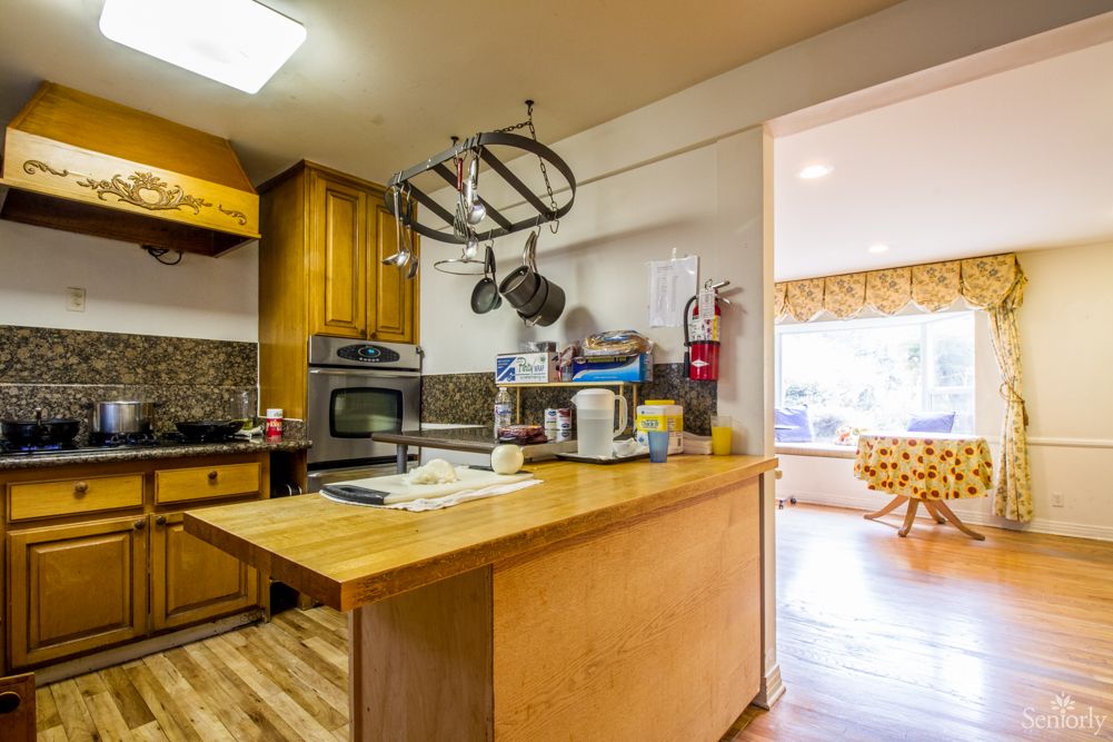 A cozy kitchen with wooden cabinets and modern appliances.