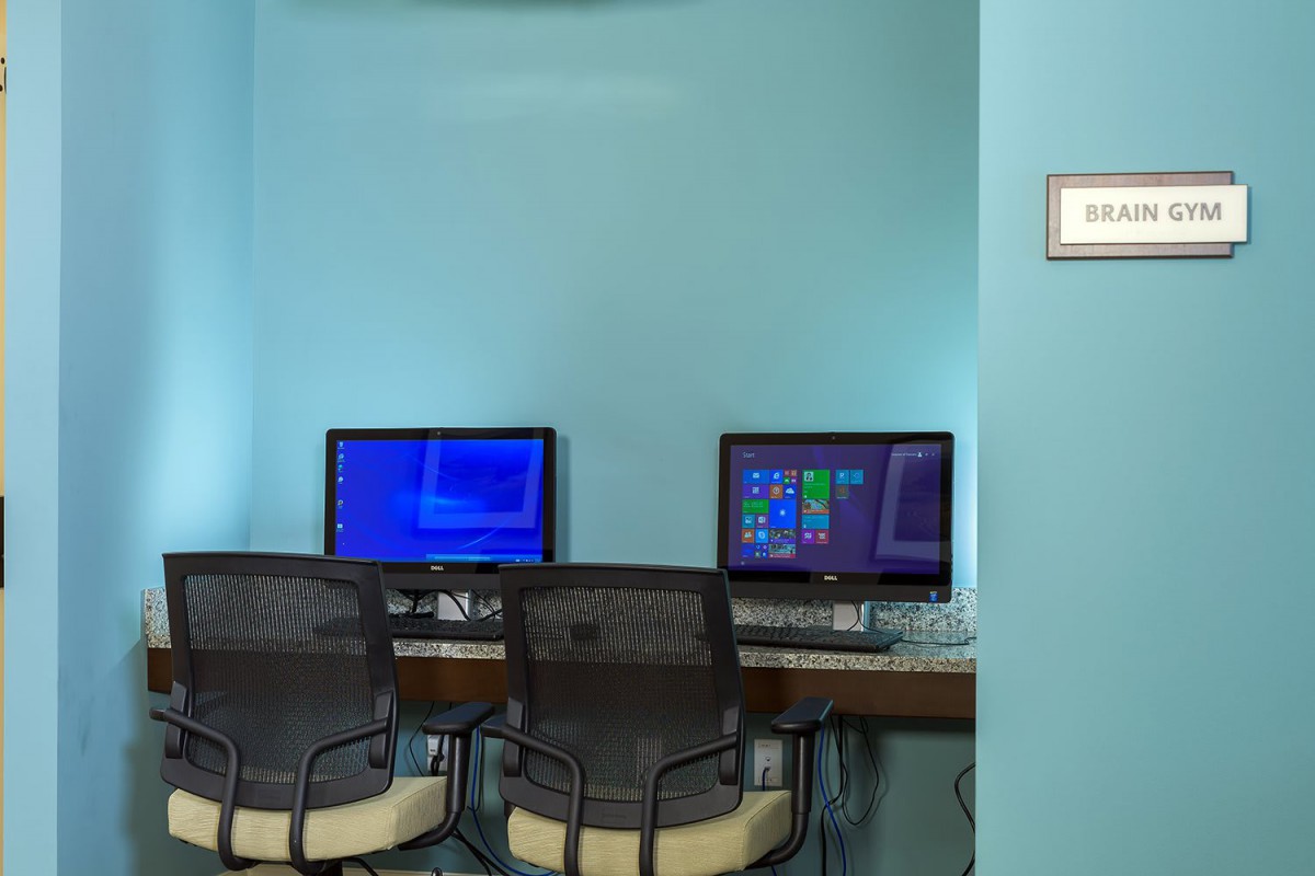 A small office space with two computer workstations and chairs.