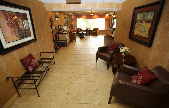 A cozy lobby area with seating and warm decor.