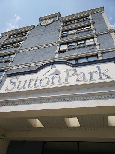 The entrance sign of Sutton Park, showcasing its architectural design.