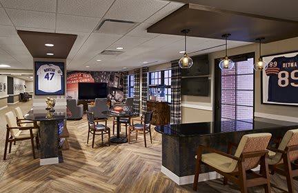 A modern and cozy lounge area with stylish furniture and warm lighting.