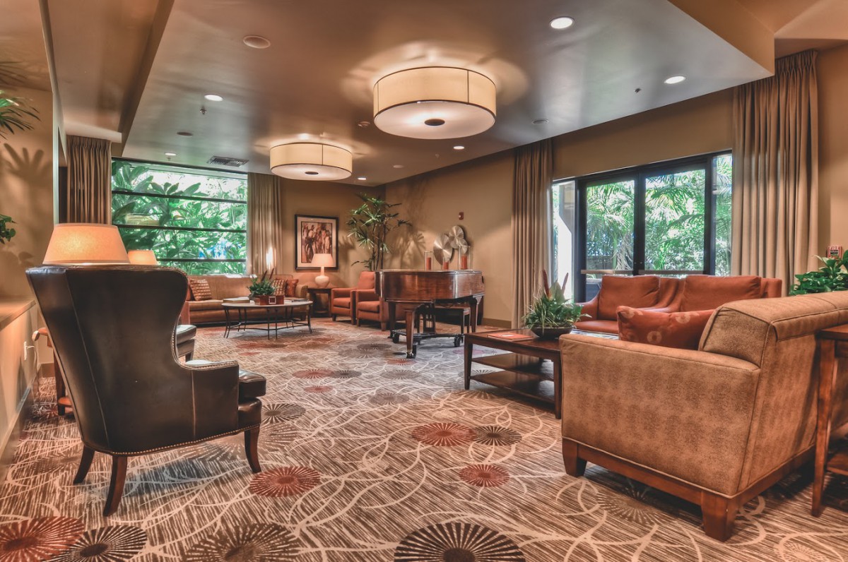 A spacious and elegantly designed lobby with comfortable seating and stylish decor.