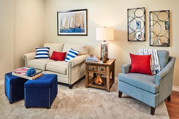 A cozy living room with nautical-themed decor and comfortable seating.