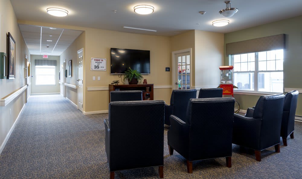 A cozy living room with comfortable chairs and a television, creating a warm and inviting atmosphere.