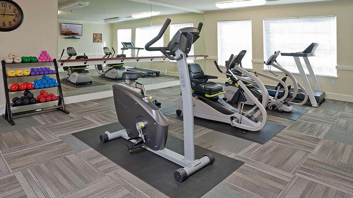 A gym with exercise bikes and fitness equipment.