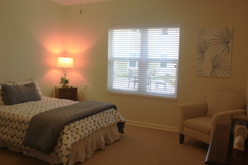 A cozy bedroom with a soft color palette and ample natural light.