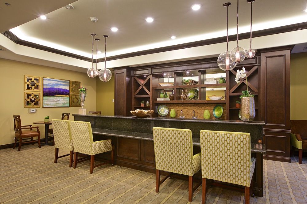 A cozy bar area with stylish seating and elegant lighting.