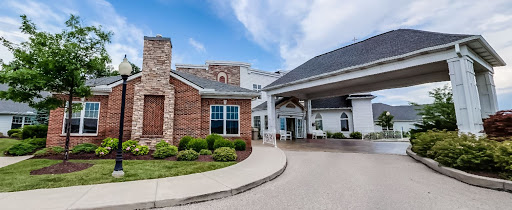 A welcoming view of a beautifully designed building with landscaped surroundings.
