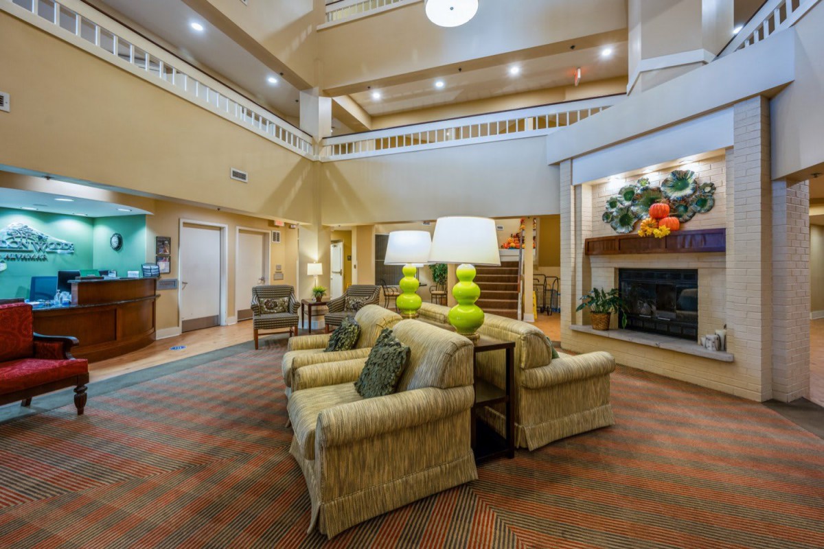 Spacious hotel lobby with comfortable seating and modern decor.