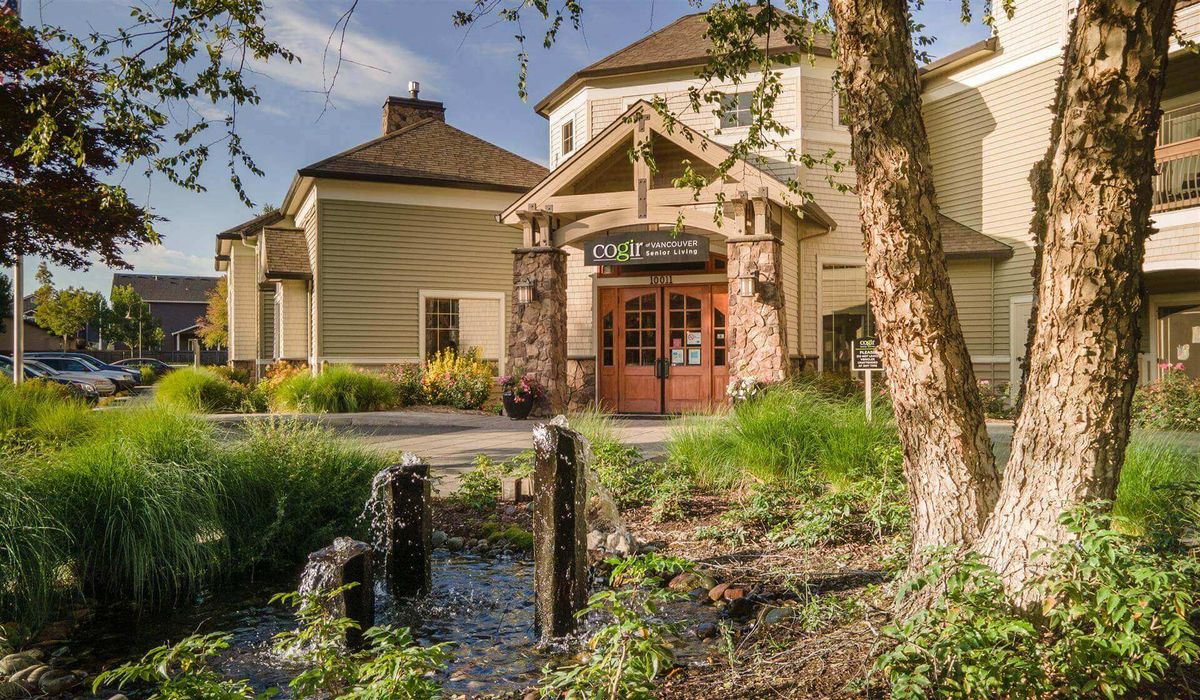 A charming restaurant exterior with lush greenery and a welcoming entrance.