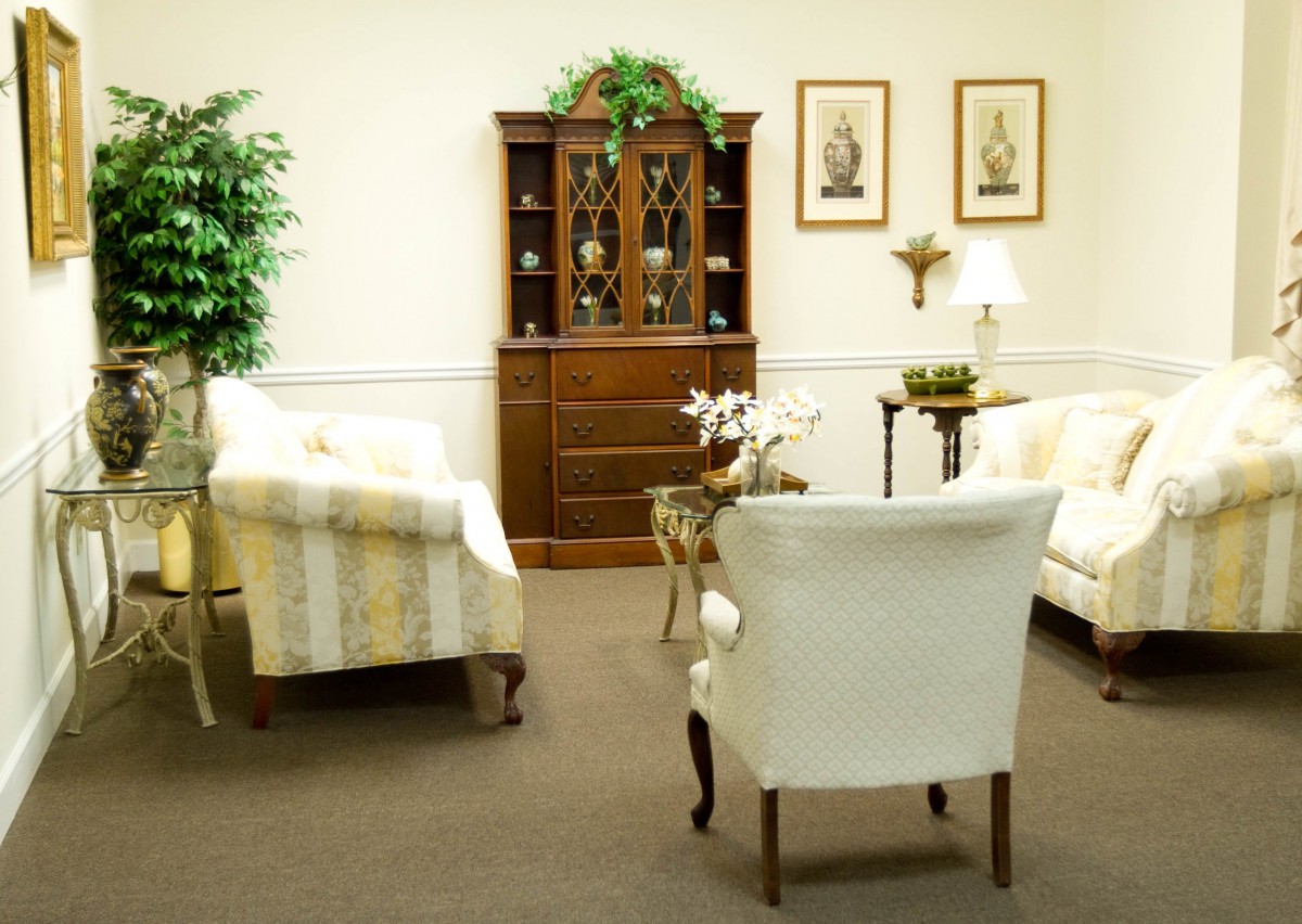 A cozy living room with elegant furniture and decorative accents.