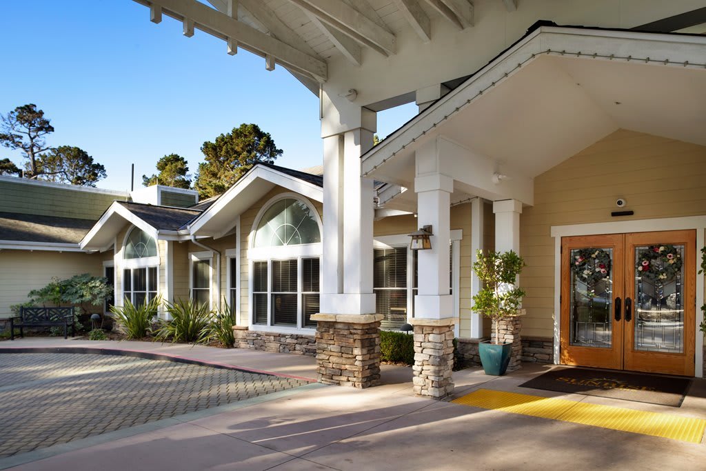 The bright and welcoming entrance of a modern building on a sunny day.