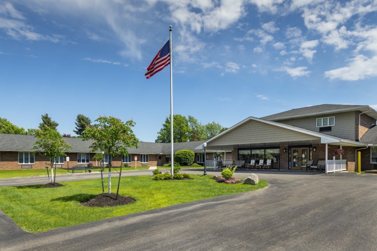 A building with an American flag on a clear sunny day.