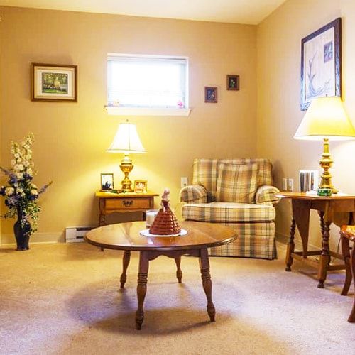 A cozy living room with warm lighting and classic furniture.