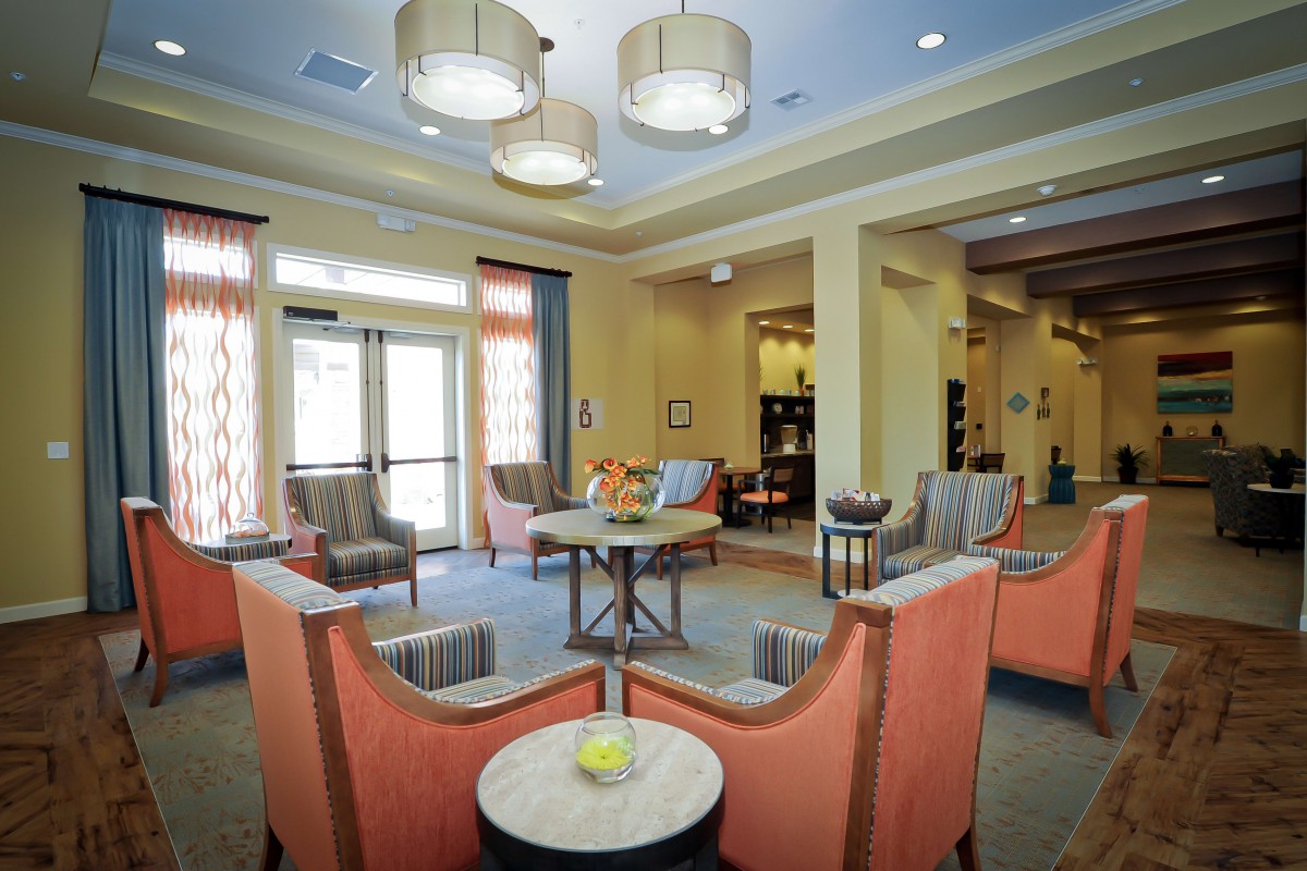 A modern lounge with comfortable seating and stylish lighting.