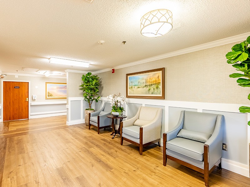 A well-lit waiting room with comfortable seating and stylish decor.