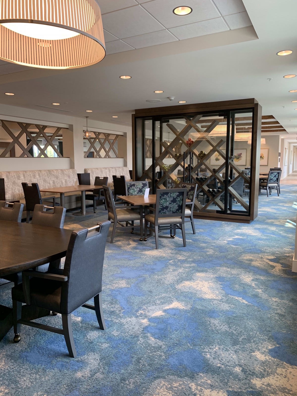 A modern restaurant dining area with stylish decor and well-arranged tables and chairs.