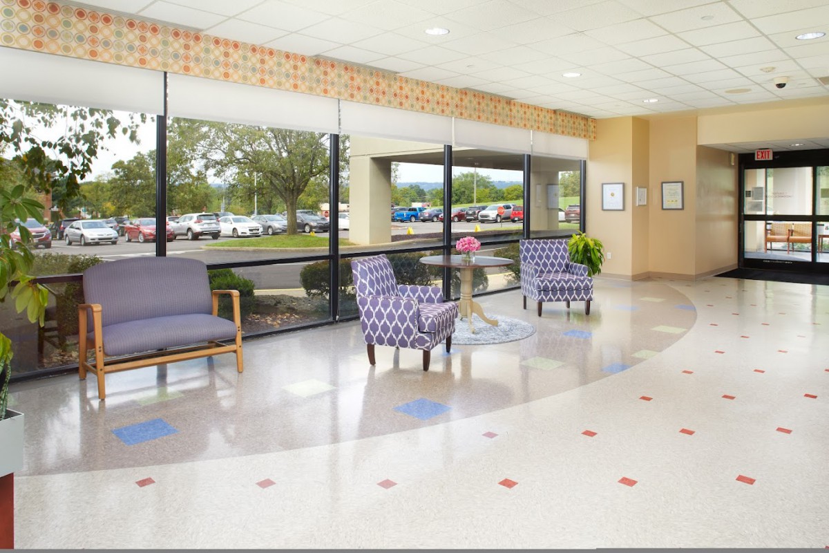 A bright and spacious lobby area with comfortable seating and large windows.