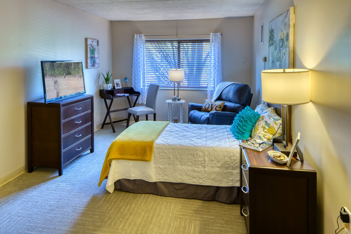 A cozy and modern bedroom with stylish decor and comfortable furnishings.