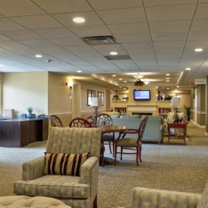 A cozy lounge area with comfortable seating and a television.