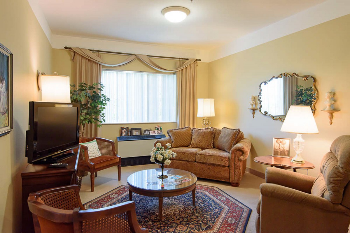 A cozy living room with comfortable seating and warm lighting.