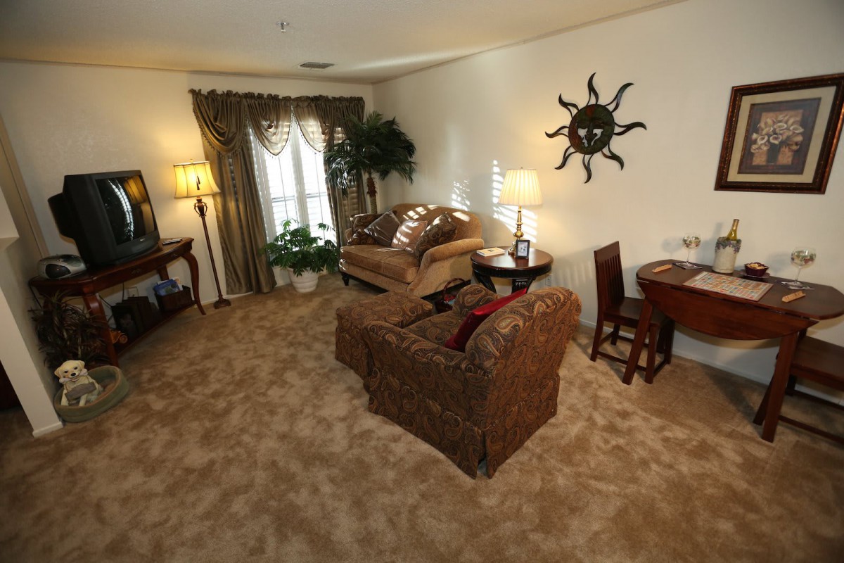 A cozy living room with comfortable seating and warm decor.