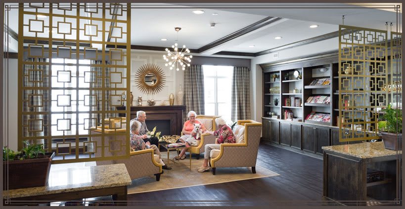 A group of seniors enjoying a conversation in a cozy living room.