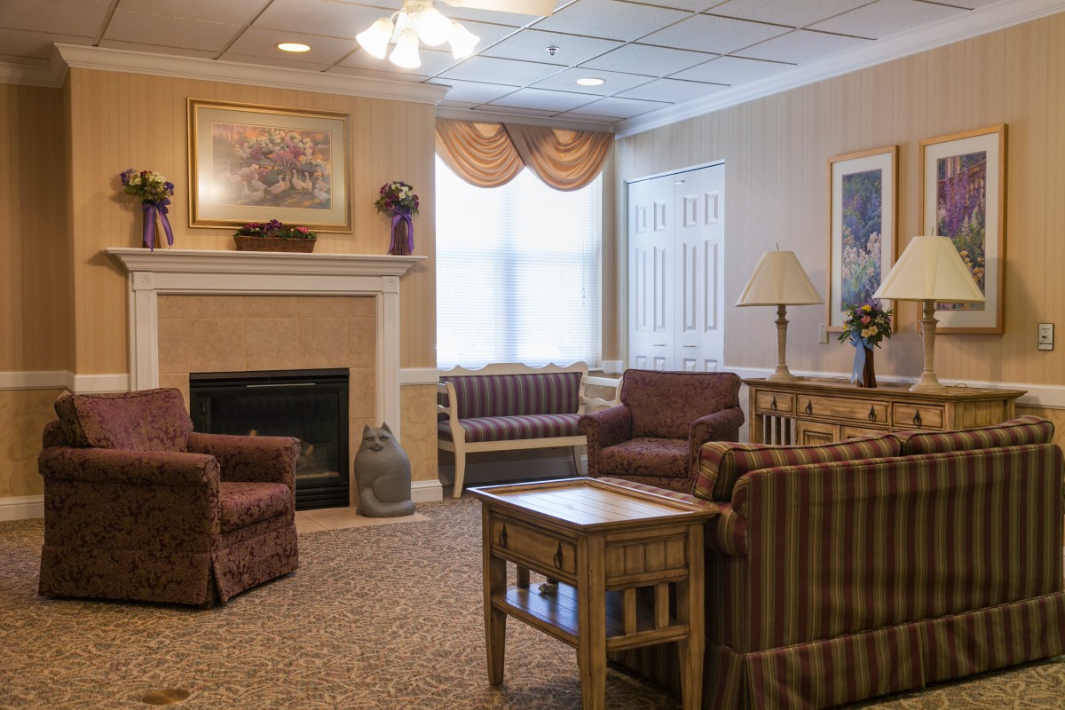 A cozy living room with comfortable seating and a fireplace.