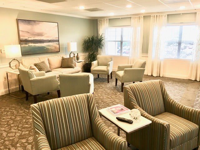 A cozy living room with comfortable seating and elegant decor.