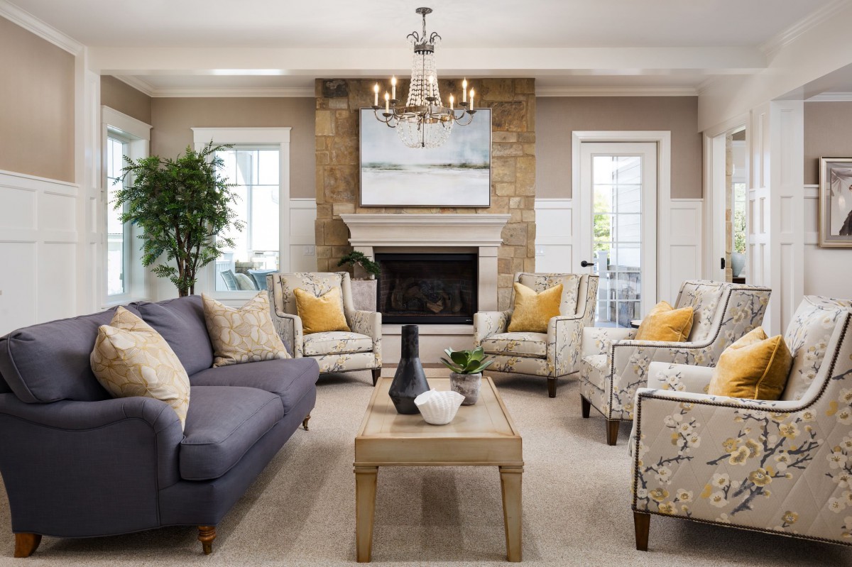 A beautifully decorated living room featuring a cozy fireplace, elegant furniture, and tasteful decor.
