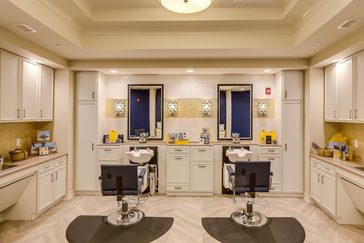 A modern barbershop interior with two styling stations and sleek design.