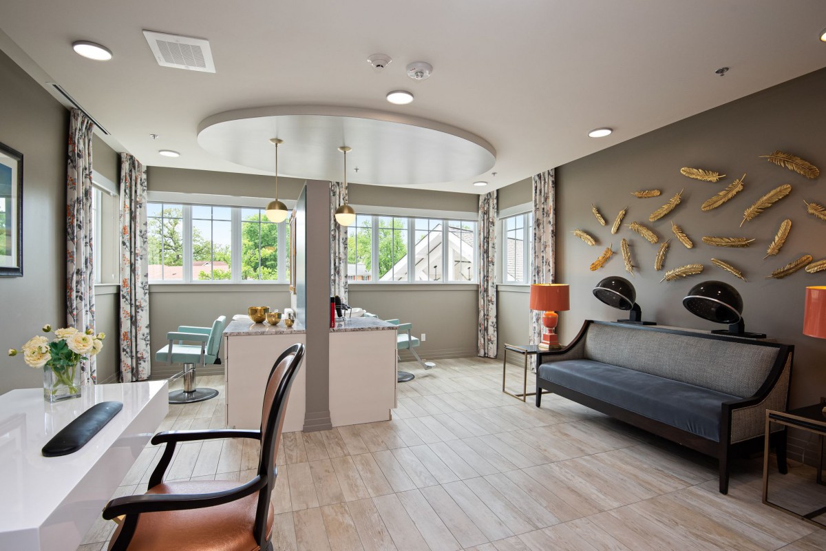 A modern living room with large windows and stylish decor.