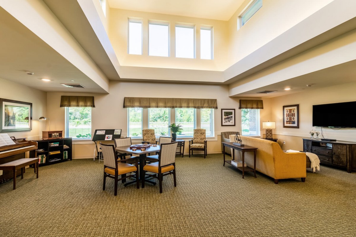 Spacious living room with high ceilings and ample natural light.