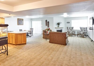 A spacious and modern open-plan living room with a dining area and comfortable seating.