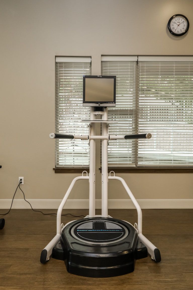 Modern gym equipment with a digital screen for interactive workouts.