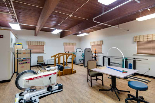 A well-equipped physical therapy room designed for rehabilitation and patient care.
