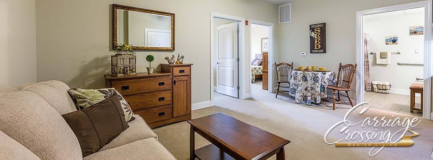 A cozy living room with wooden furniture and tasteful decor.