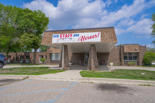 A building showcasing a sign that expresses appreciation for its staff, highlighting their heroic contributions.