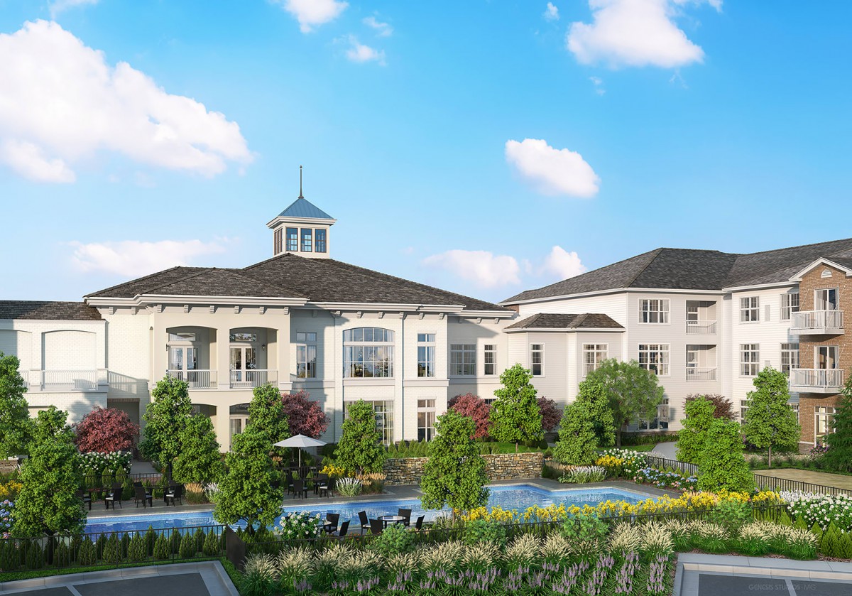 A beautiful residential building with a manicured garden and clear blue skies.