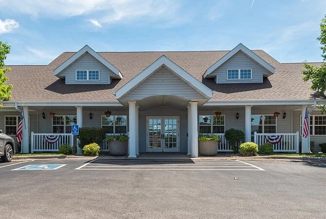 A suburban-style building with a welcoming entrance and surrounding landscaping.