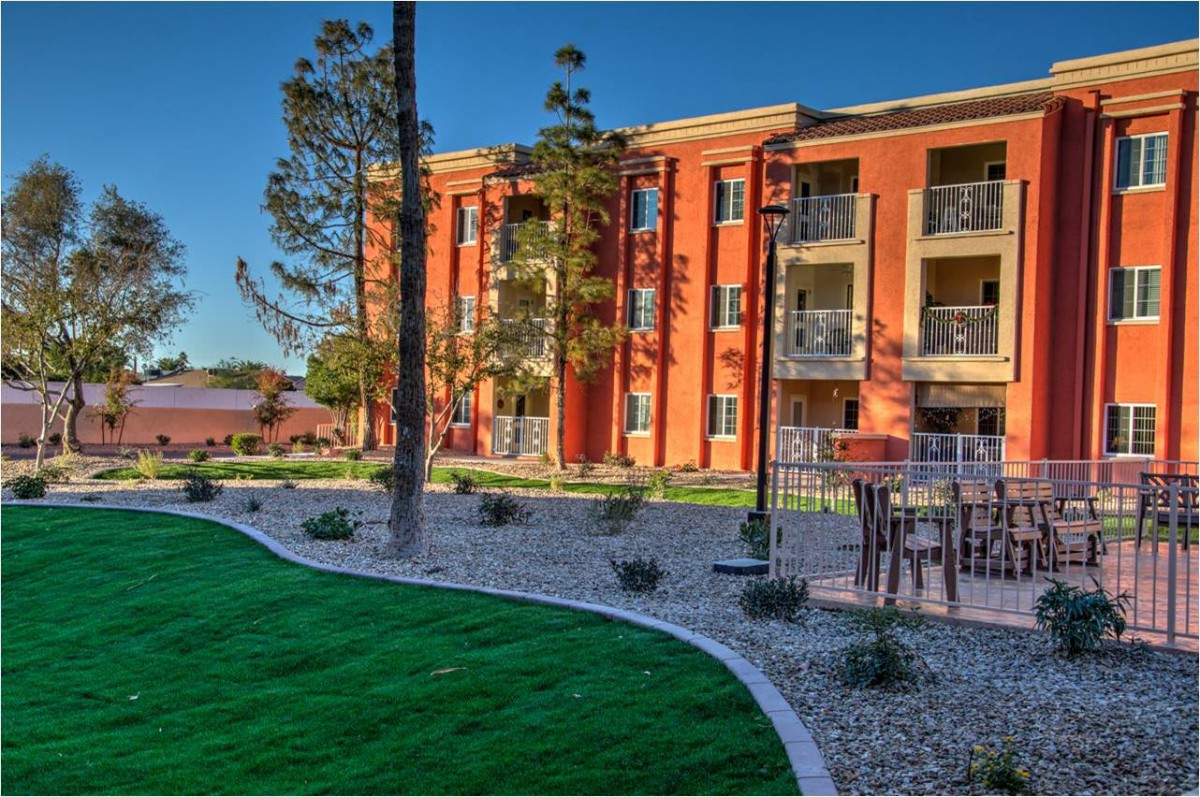 A well-maintained residential apartment complex with landscaped gardens.