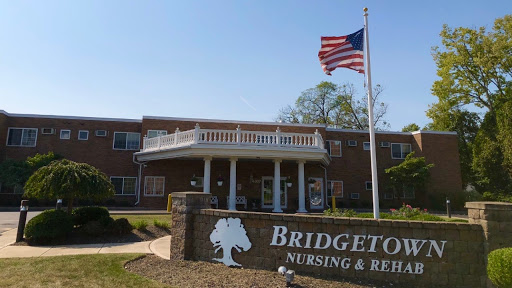 Bridgeton Nursing & Rehabilitation Center with the American flag flying in front.