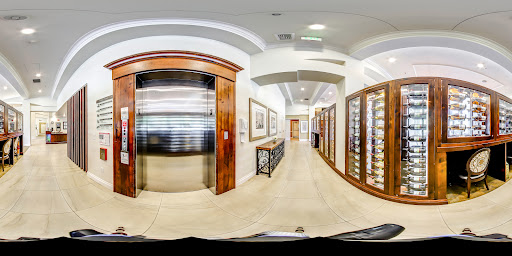 A spacious hallway featuring a sleek elevator and elegant wooden accents.
