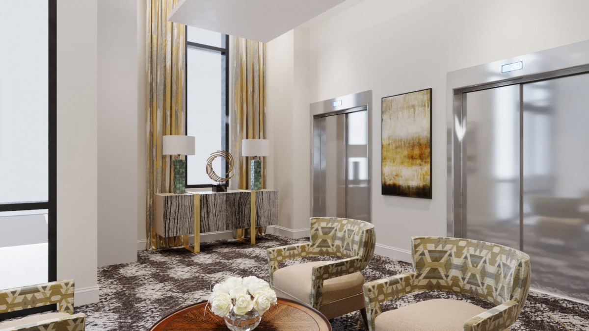 A modern and elegantly designed lobby featuring stylish furniture, beautiful artwork, and elevators.