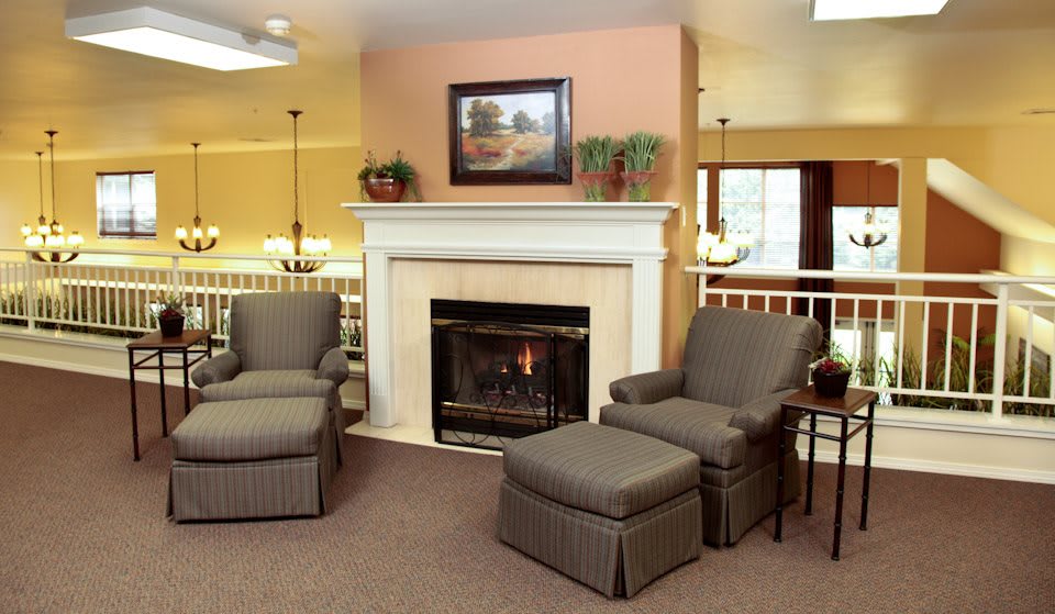 A cozy living room featuring a fireplace and comfortable seating.