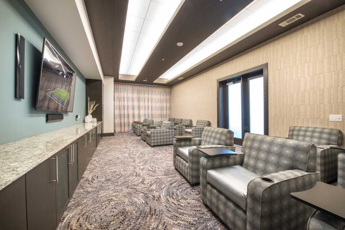 A modern lounge with comfortable seating and elegant decor.